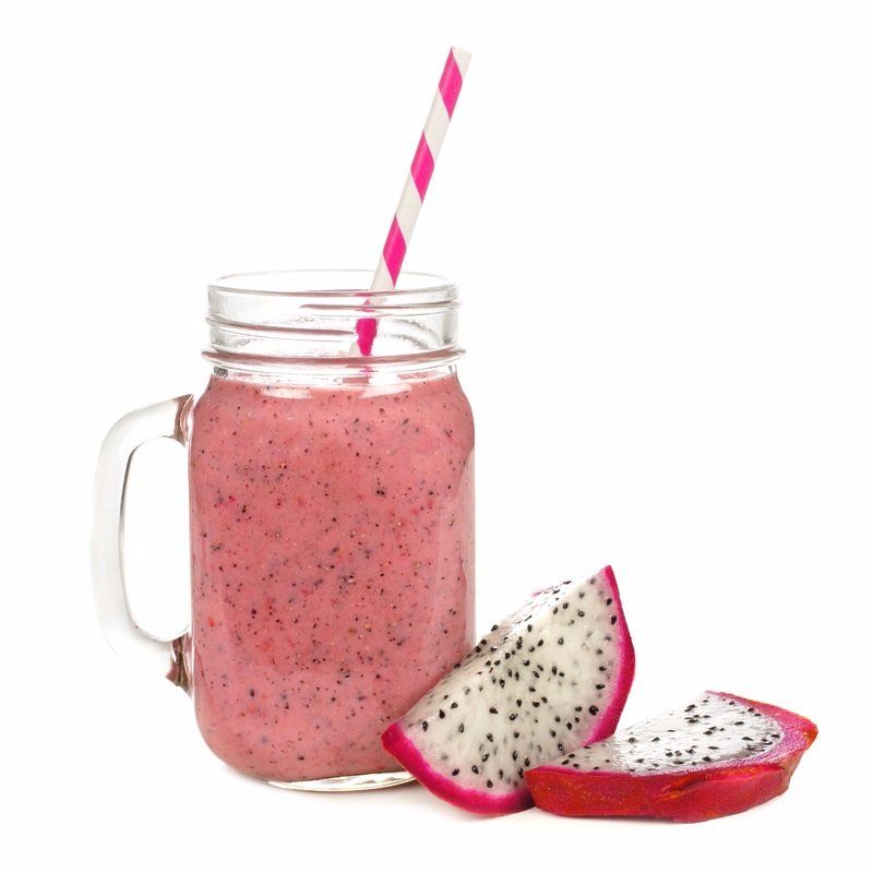 a smoothie in a mason jar with a pink and white striped straw